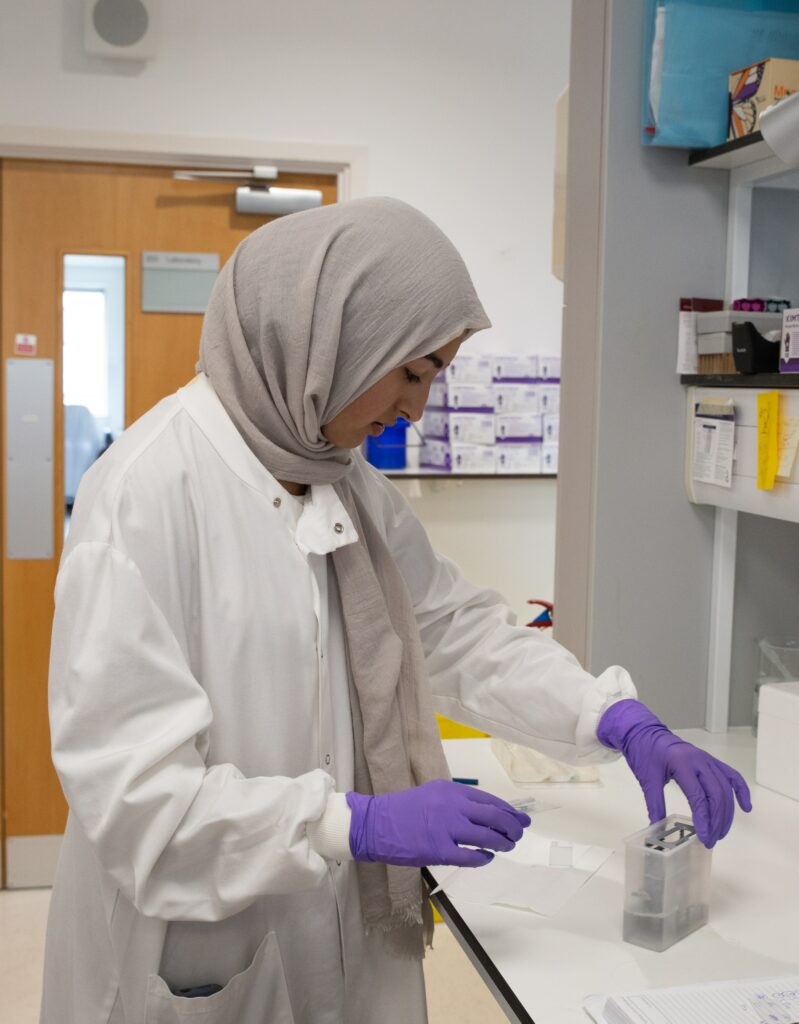 An ASTP student working in the lab