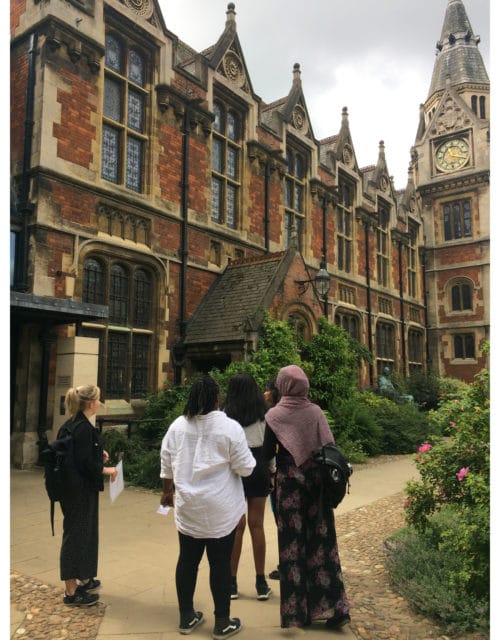 Students looking at the Pembroke College building