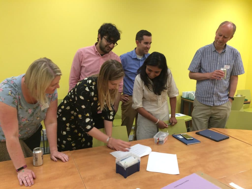SCoPE Project Team working around a table on one of the toolkits