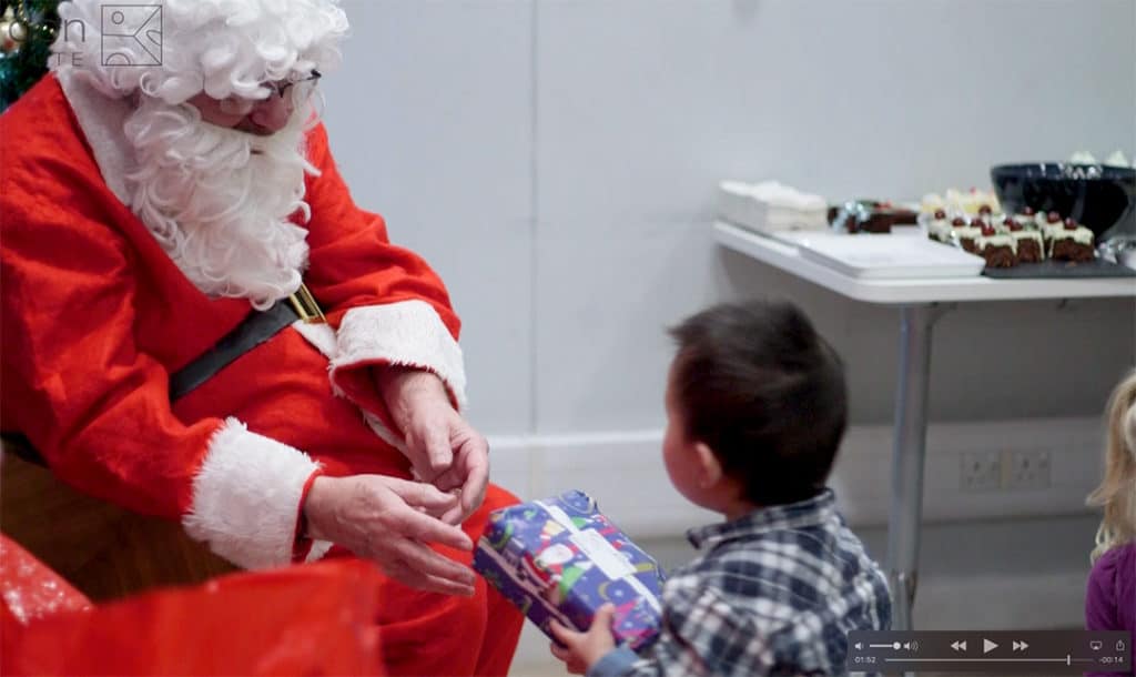Father Christmas and child in video Parents and children, Year in Institute life series